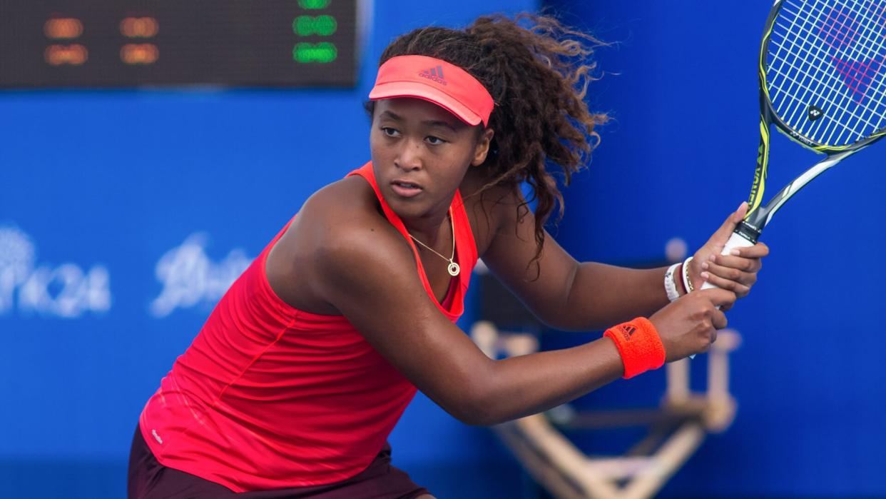 HUA HIN, THAILAND-NOVEMBER 13:Naomi Osaka of Japan returns a ball during Day 5 of EA Hua Hin Championship 2015 on November 13, 2015 at Hua Hin Centennial Club in Hua Hin, Thailand.