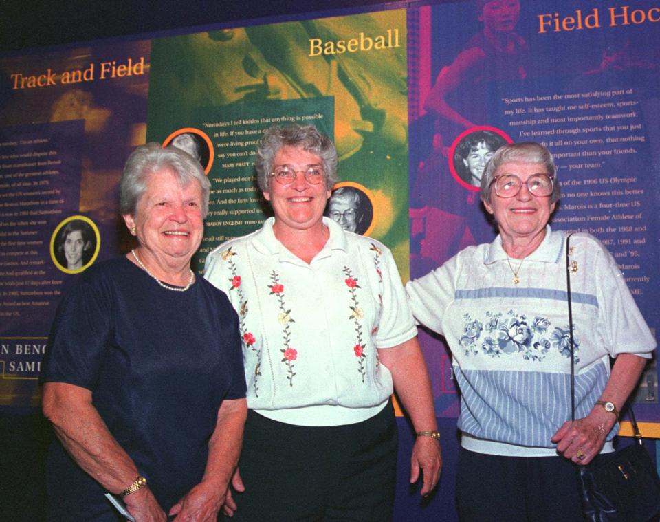 Former women's professional baseball players Mary Pratt, left, of Quincy, Mass., and Maddy English, right,  of Everett, Mass., are joined by their friend Marie Cronin, center,  at the opening, Tuesday, Aug. 3, 1999, of the New England Women's Sports Hall of Fame in Saugus, Mass. Pratt and English were members of the All-American Girls Professional Baseball League in the 1940s. The musuem honors New England women athletes in every major sport. (AP Photo/Steven Tackeff)