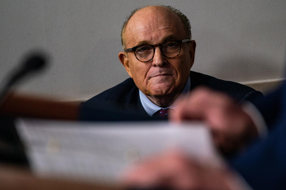 Rudy Giuliani listens as President Trump speaks during a news briefing at the White House in Washington, D.C., on Sept. 27, 2020.<span class="copyright">Salwan Georges—The Washington Post/Getty Images</span>