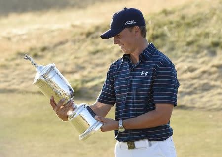 Jun 21, 2015; University Place, WA, USA; Jordan Spieth looks at the U.S. Open Championship Trophy after winning the 2015 U.S. Open golf tournament at Chambers Bay. Mandatory Credit: Michael Madrid-USA TODAY Sports