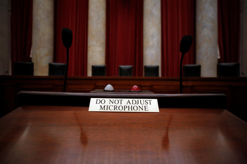 A notice is seen on a lectern where lawyers stand to argue before the Supreme Court justices.