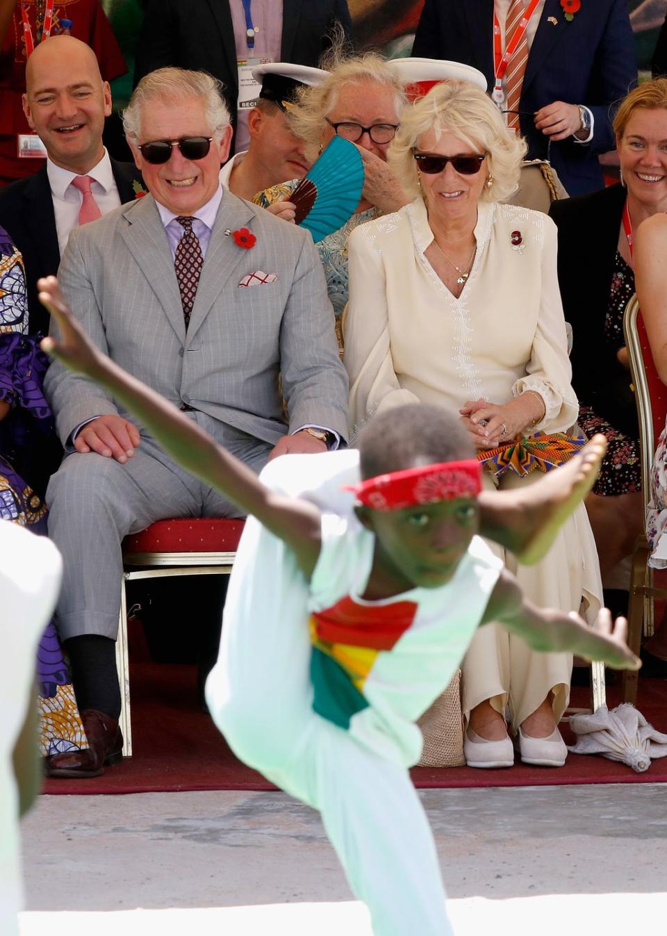 <p>Prince Charles and Camilla watch a performance at an arts exhibition in Jamestown, Accra. </p>