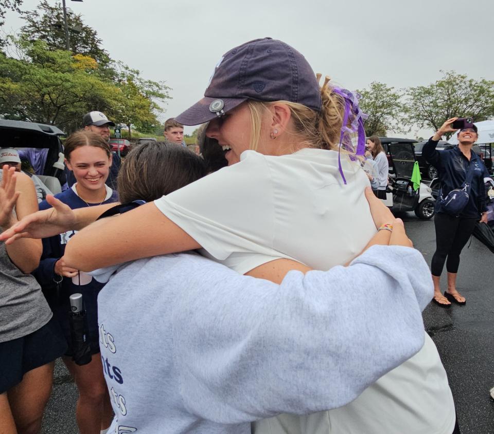 Central Catholic senior Sophia Royer (right) absorbs hugs from freshmen Lilly Frey and Claire Lewis after the Knights finished third at the IHSAA Sectional Championships at Coyote Crossing Golf Club on Monday, Sept. 23, 2024.