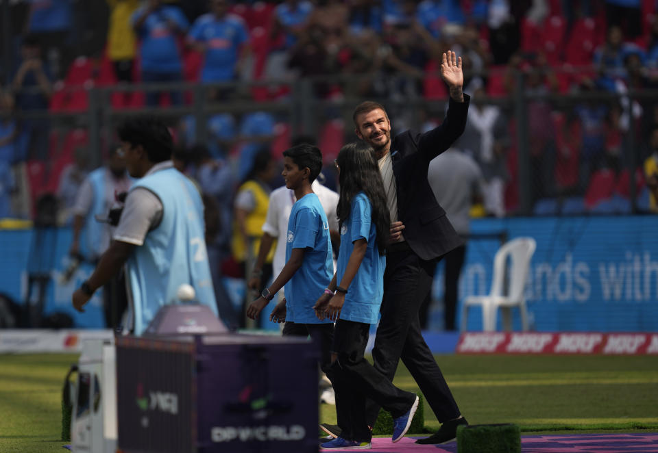 Former soccer star David Beckham waves as he leaves the ground at the start of the ICC Men's Cricket World Cup first semifinal match between India and New Zealand, in Mumbai, India, Wednesday, Nov. 15, 2023. (AP Photo/Rafiq Maqbool)