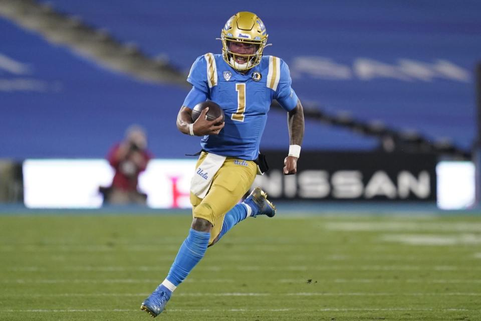 UCLA quarterback Dorian Thompson-Robinson runs the ball during the second quarter against USC on Dec. 12, 2020.