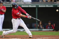 Cleveland Guardians' Austin Hedges hits a two-RBI double during the second inning of a baseball game against the Los Angeles Angels, Monday, Sept. 12, 2022, in Cleveland. (AP Photo/David Dermer)