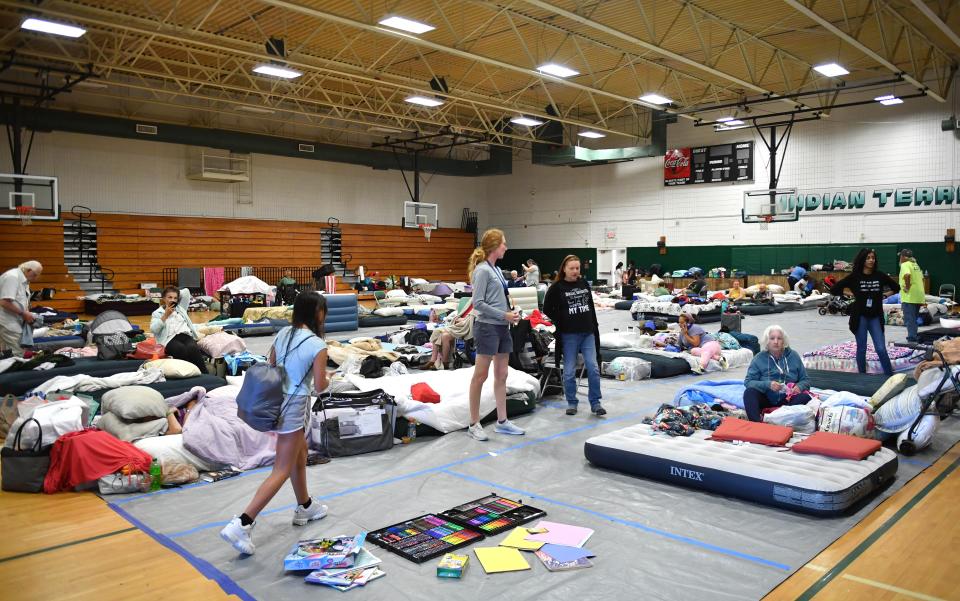 The old gym at Venice High School was being used to house evacuees Monday, Oct. 3, 2022, in Venice, Fla., after Hurricane Ian.