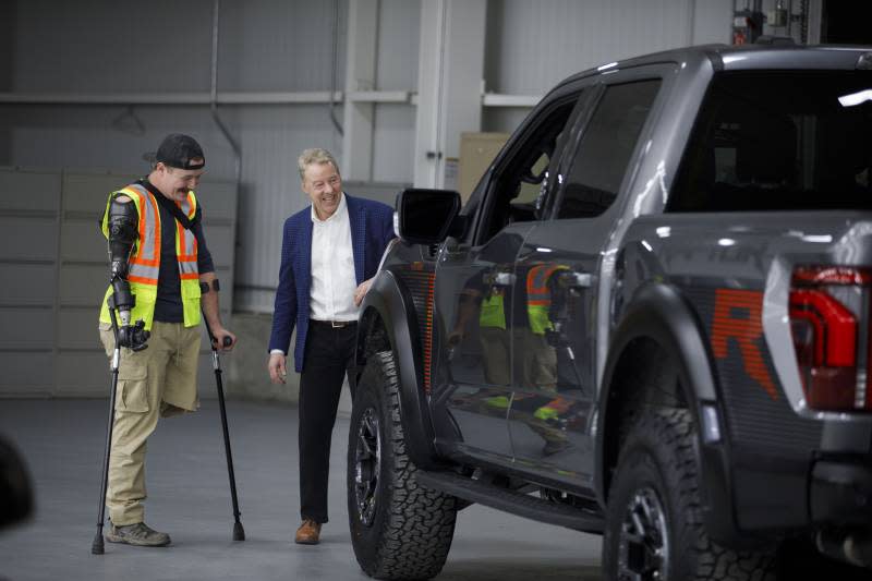 Retired U.S. Marine Sgt. Tyler Vargas-Andrews met Ford Motor Co. executive chairman Bill Ford when touring Dearborn Truck Plant on Tuesday, Feb. 13, 2024. Vargas-Andrews received a new Ford F-150 Raptor R from Ford after his 2023 Raptor was wrecked in an accident.