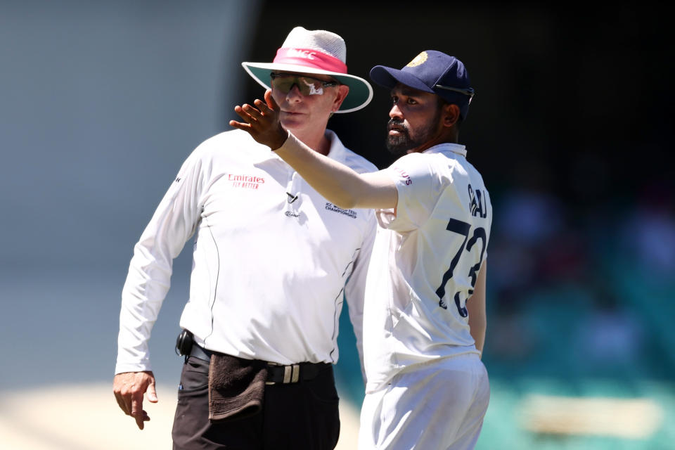 SYDNEY, AUSTRALIA - JANUARY 10: Mohammed Siraj of India stops play to make a formal complaint about some spectators in the bay behind his fielding position during day four of the Third Test match in the series between Australia and India at Sydney Cricket Ground on January 10, 2021 in Sydney, Australia. (Photo by Cameron Spencer/Getty Images)