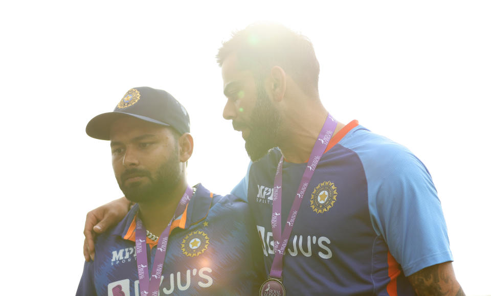 Virat Kohli (pictured) embrace Rishabh Pant (pictured right) after the 3rd One Day International.