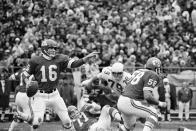 FILE - Kansas City Chiefs quarterback Len Dawson gestures as he gets set to pass in a game with the St. Louis Cardinals in Kansas City, on Nov. 23, 1970. The game was played to a 6-6 tie. Hall of Fame quarterback Len Dawson, who helped the Kansas City Chiefs to a Super Bowl title, died Wednesday, Aug. 24, 2022. He was 87. (AP Photo/William P. Straeter, File)