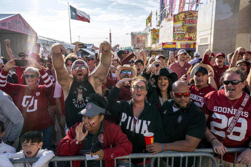 Oklahoma fans cheers before an NCAA college football game against Texas at the Cotton Bowl, Saturday, Oct. 7, 2023, in Dallas. (AP Photo/Jeffrey McWhorter)