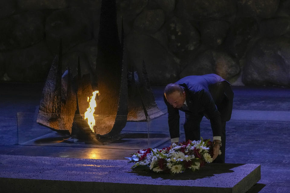 Turkish Foreign Minister Mevlut Cavusoglu lays a wreath at the Hall of Remembrance in the Yad Vashem World Holocaust Remembrance Center in Jerusalem, Wednesday, May 25, 2022. (AP Photo/Maya Alleruzzo)