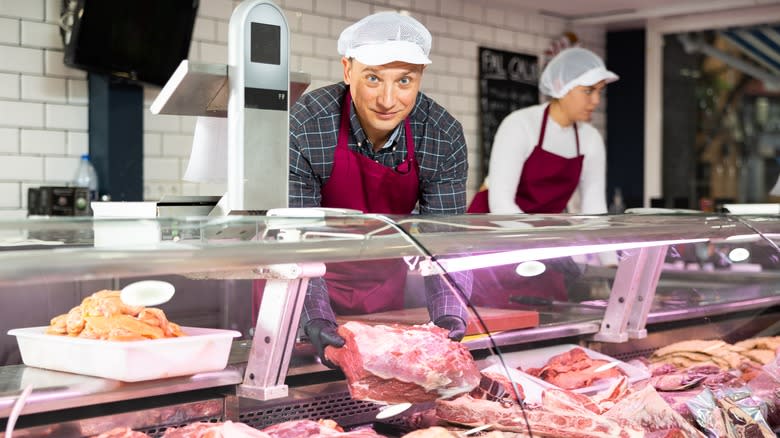 butcher in butcher shop