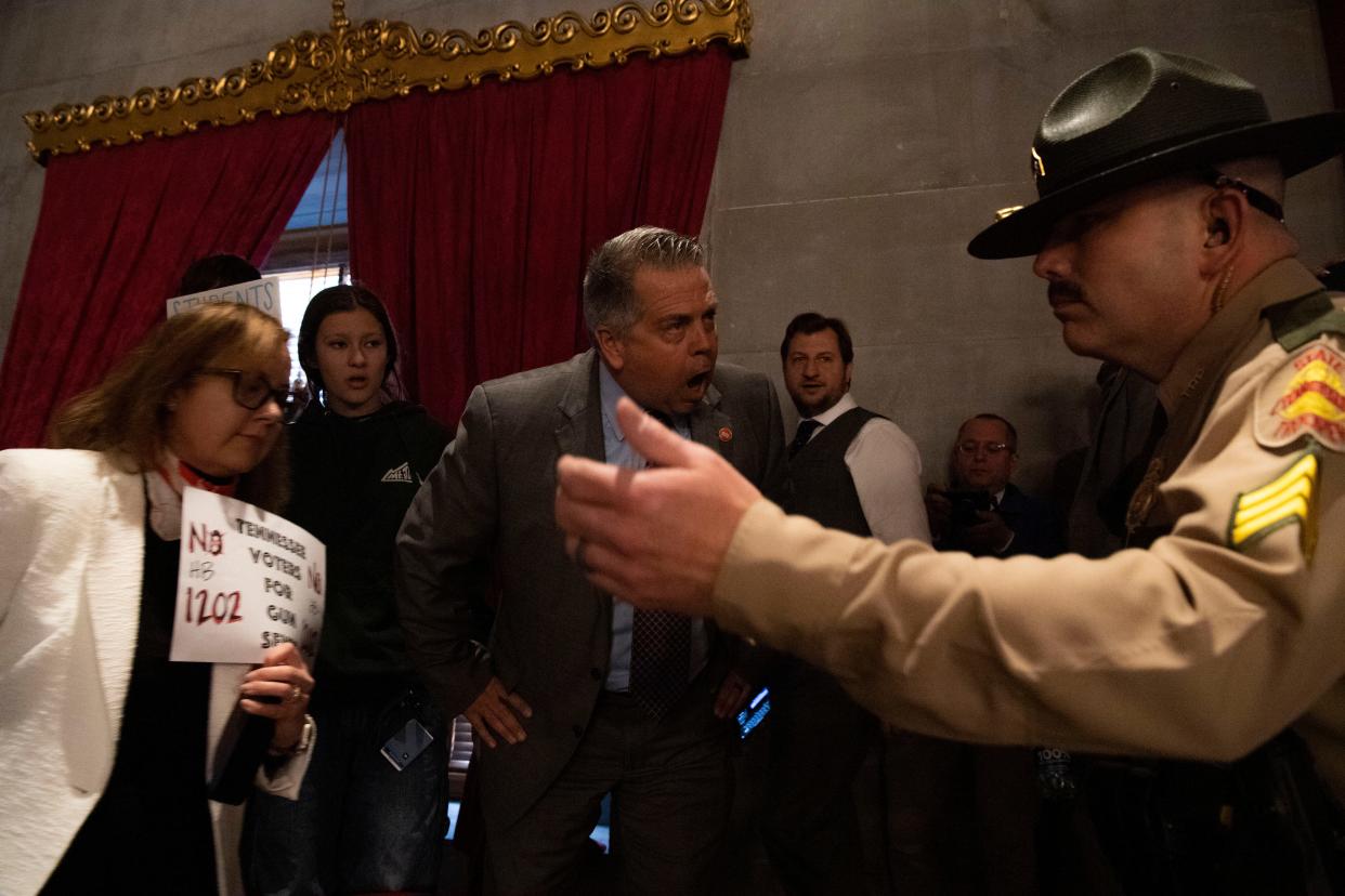 Rep. Bo Mitchell D-Nashville, yells as state troopers remove protesters from the gallery under the order of House Speaker Cameron Sexton after the house voted in SB 1325 during session at the Tennessee Capitol in Nashville, Tenn., Tuesday, April 23, 2024.