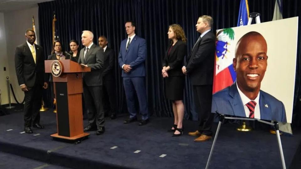 Matthew Olsen, Assistant Attorney General for National Security, speaks during a news conference Tuesday in Miami. U.S. authorities have arrested four more people in the slaying of Haitian President Jovenel Moïse, including the owner of a Miami-area security company that hired former soldiers from Colombia for the mission. At left is Markenzy Lapointe, U.S. Attorney for the Southern District of Florida, and at right is an image of Haitian President Jovenel Moïse, (Photo: Lynne Sladky/AP)