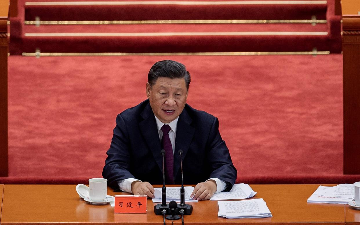 Mr Xi gave a rare public address on the situation in Xinjiang Province - NICOLAS ASFOURI /AFP