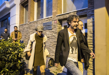 German-Turkish journalist Deniz Yucel and his wife, Dilek Mayaturk Yucel, are pictured in front of their home after Deniz Yucel was released from prison in Istanbul, Turkey, February 16, 2018. Depo Photos via REUTERS