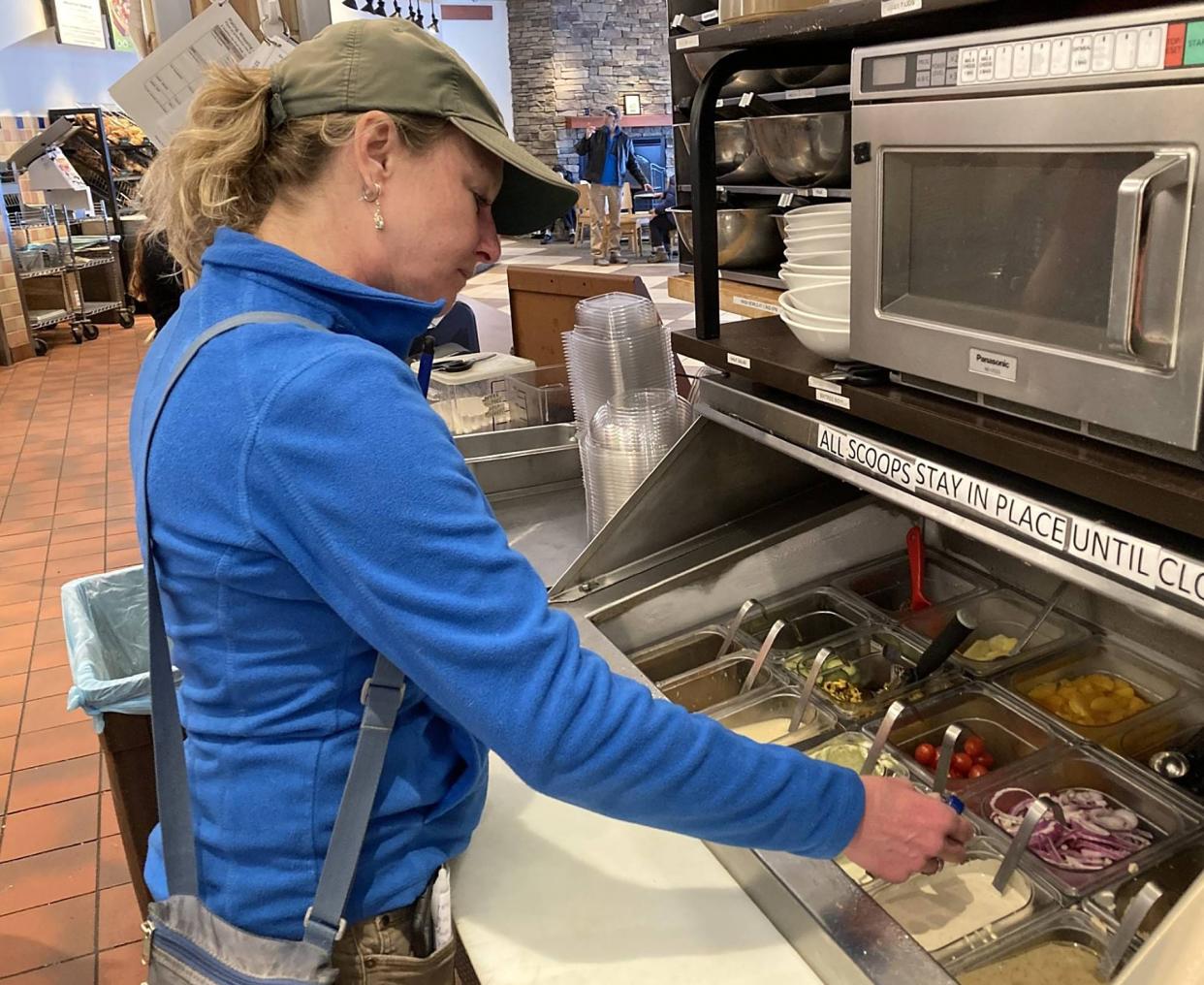 Lisa Susann checks the temperatures of salad dressings at Panera Bread, 2501 W. 12th St. Susann is an environmental protection specialist with the Erie County Department of Health.