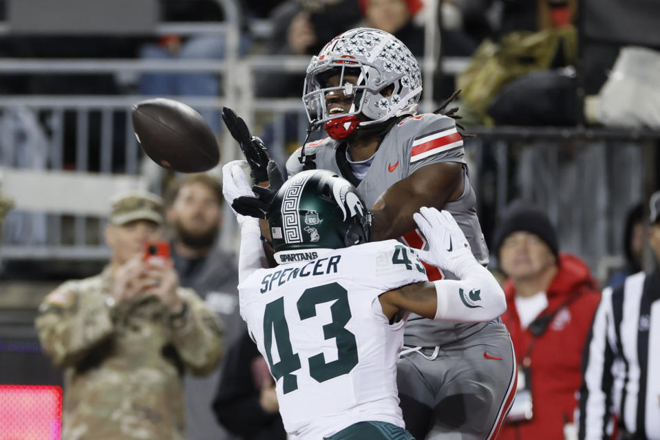 Michigan State defensive back Malik Spencer, front, breaks up a pass intended for Ohio State receiver Marvin Harrison during the second half of an NCAA college football game Saturday, Nov. 11, 2023, in Columbus, Ohio. (AP Photo/Jay LaPrete)