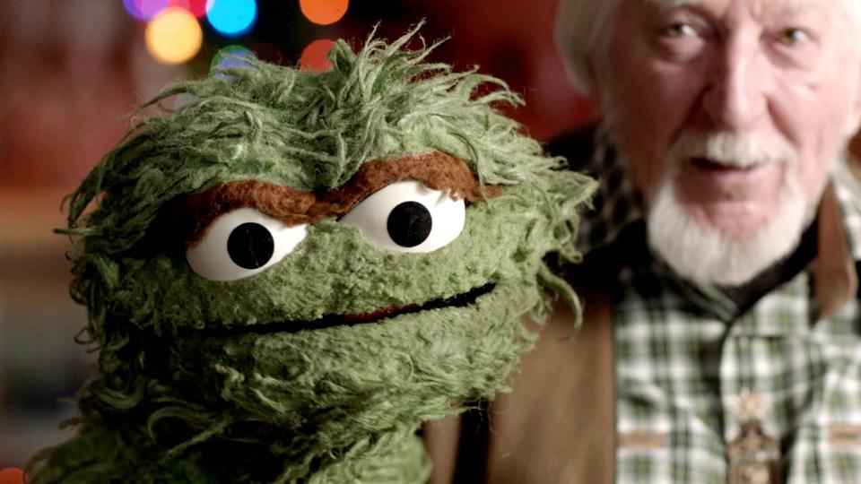 Puppeteer Caroll Spinney poses with one of his iconic characters, Oscar the Grouch, in the documentary "Street Gang: How We Got to Sesame Street."