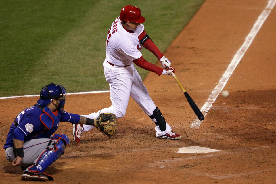 ST LOUIS, MO - OCTOBER 19: Allen Craig #21 of the St. Louis Cardinals hits an RBI single in the bottom of the sixth inning during Game One of the MLB World Series against the Texas Rangers at Busch Stadium on October 19, 2011 in St Louis, Missouri. (Photo by Doug Pensinger/Getty Images)