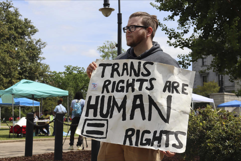 Dylan Michael Turner, 27, stands outside a Transgender Day of Visibility event in Columbia, S.C., Friday, March 31, 2023. (AP Photo/James Pollard)