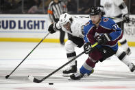 Colorado Avalanche right wing Joonas Donskoi, right, takes the puck as Los Angeles Kings left wing Alex Iafallo reaches for it during the second period of an NHL hockey game Saturday, Feb. 22, 2020, in Los Angeles. (AP Photo/Mark J. Terrill)