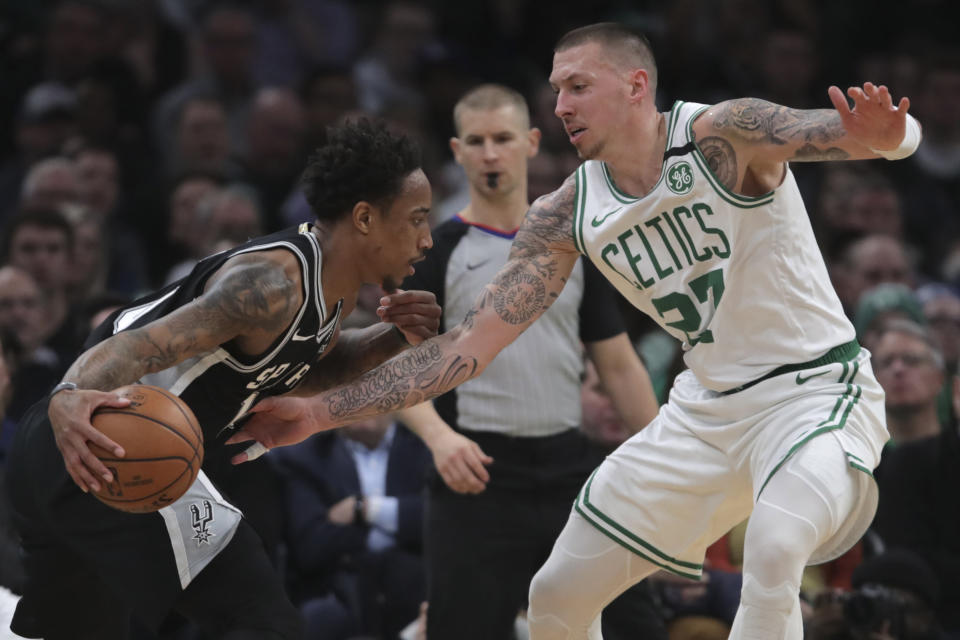 San Antonio Spurs guard DeMar DeRozan, left, drives to the basket against Boston Celtics forward Daniel Theis (27) during the third quarter of an NBA basketball game, Wednesday, Jan. 8, 2020 in Boston. (AP Photo/Charles Krupa)