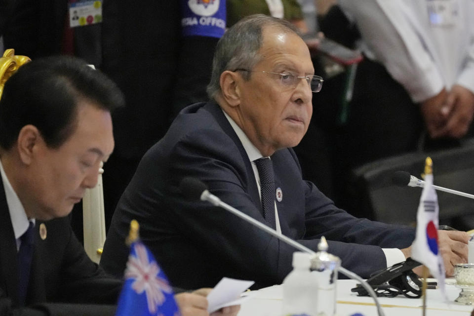 FILE - Sitting next to South Korea President Yoon Suk Yeol, left, Russian Foreign Minister Sergey Lavrov listens during the ASEAN Australia-New Zealand Trade Area (AANZTA) in Phnom Penh, Cambodia, Sunday, Nov. 13, 2022. Lavrov has been taken to the hospital after suffering a health problem following his arrival for the Group of 20 summit in Bali, Indonesian authorities said Monday. (AP Photo/Heng Sinith, File)