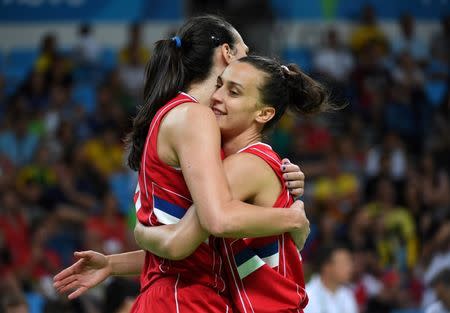 Aug 20, 2016; Rio de Janeiro, Brazil; Serbia guard/forward Ana Dabovic (14) and Serbia power forward Jelena Milovanovic (9) celebrates against France in the women's basketball bronze medal match during the Rio 2016 Summer Olympic Games at Carioca Arena 1. Mandatory Credit: RVR Photos-USA TODAY Sports