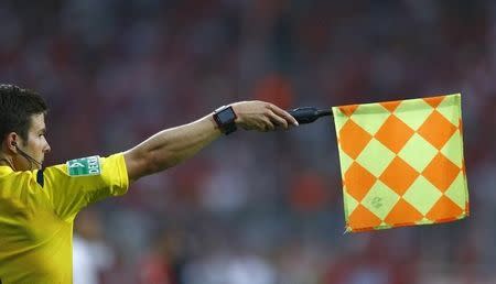 File photo of a match official, wearing a goal-line technology (GLT) watch during the opening soccer match of the new Bundesliga season between reigning champions Bayern Munich and Hamburger SV, in Munich, Germany August 14, 2015. REUTERS/Michaela Rehle