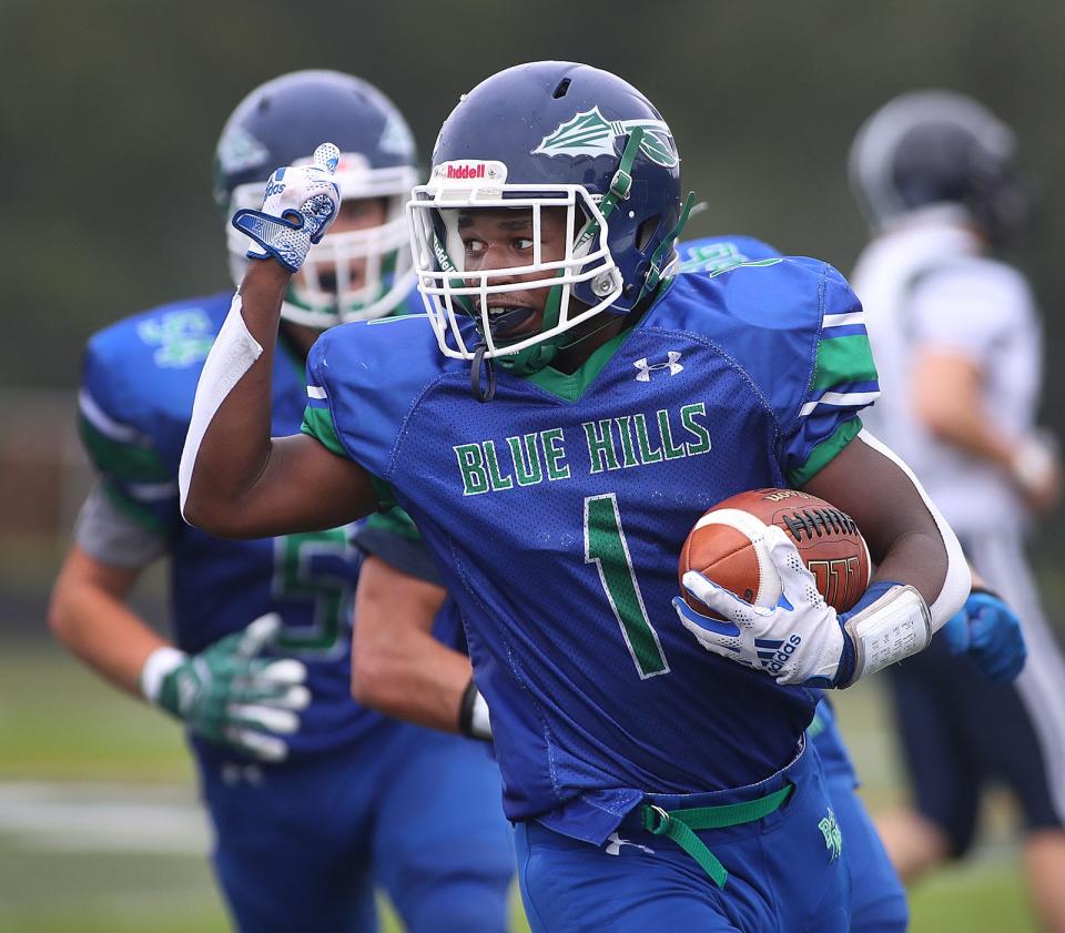 Warrior Caiden Montas raises his fist as he gets in the end zone.Blue Hill VoTech hosts Essex Tech football on Friday September 17, 2021 