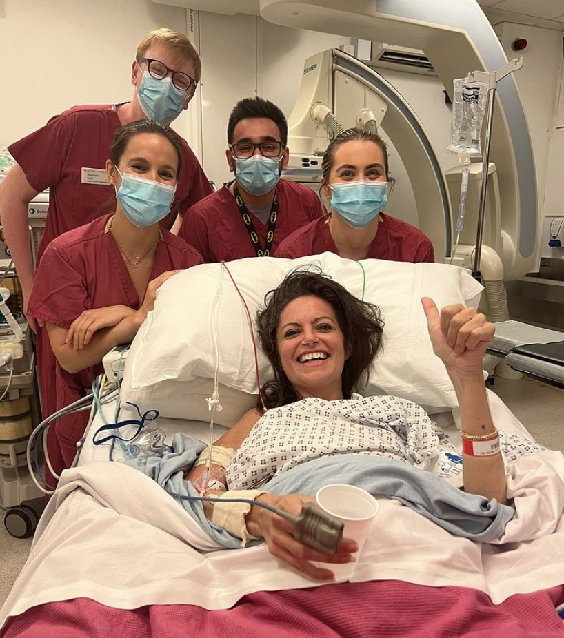 Deborah James in hospital surrounded by nurses. 