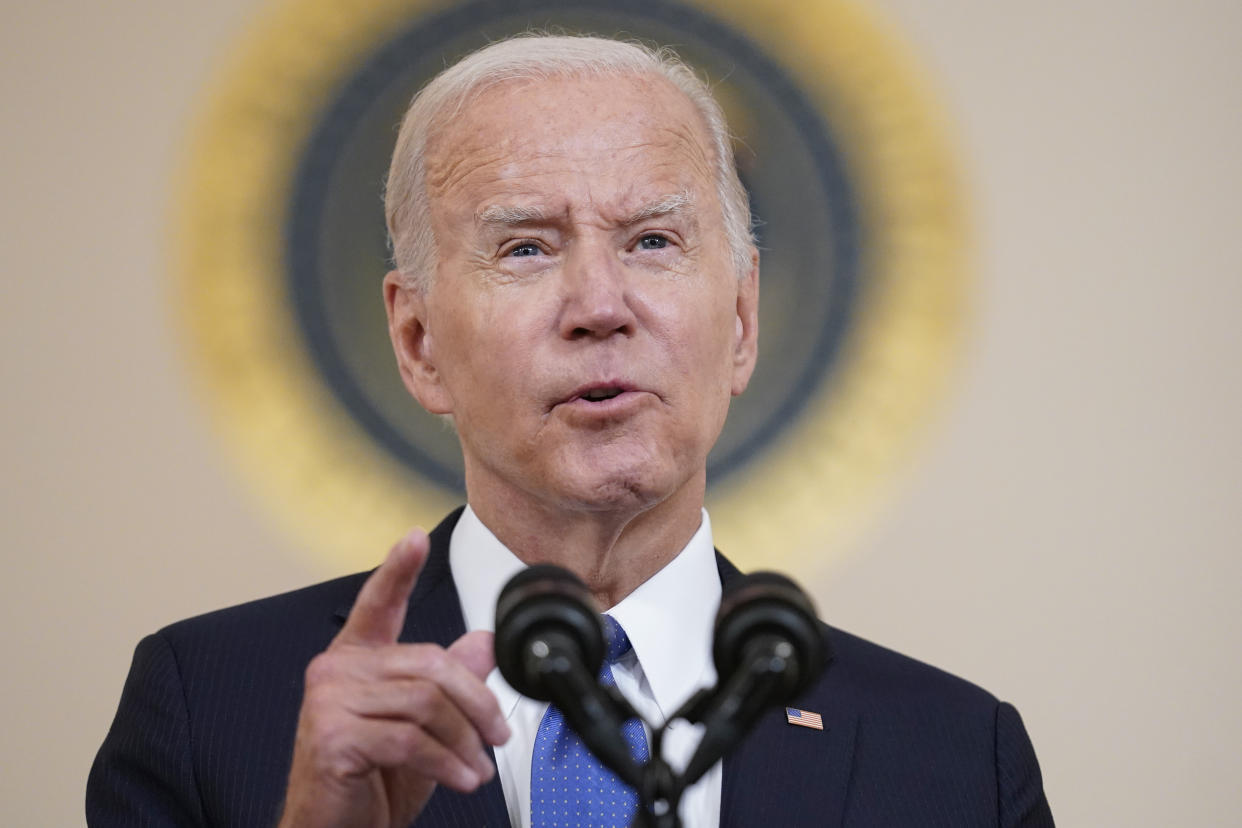 President Biden at the microphone, earnestly making a point.