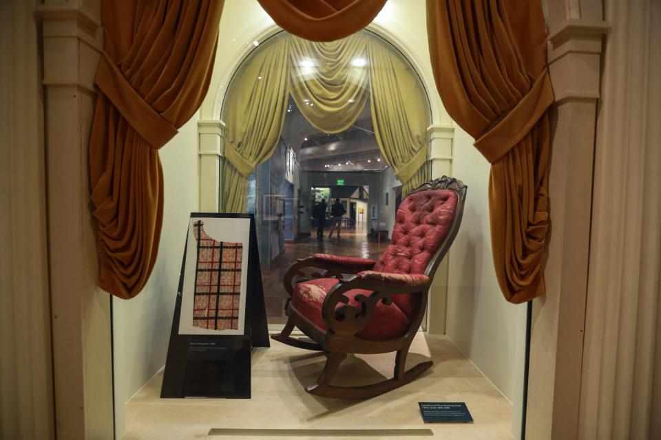 The upholstered seat rocking chair in which President Abraham Lincoln was assassinated on April 14, 1865, that was originally located in the president's special box in Ford's Theatre, Washington, D.C. sits on display on Friday, April 10, 2015, at the Henry Ford Museum in Dearborn.