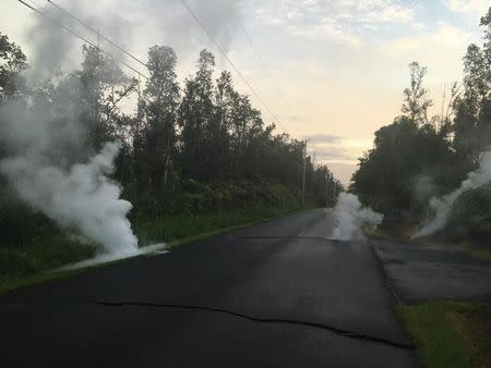 Steam cracks are shown before a fissure opened on Kaupili Street in the Leilani Estates subdivision caused by an eruption of the Kilauea Volcano is shown following a series of earthquakes, in Hawaii, U.S. on May 4, 2018. Picture taken on May 4, 2018. USGS/Handout via REUTERS