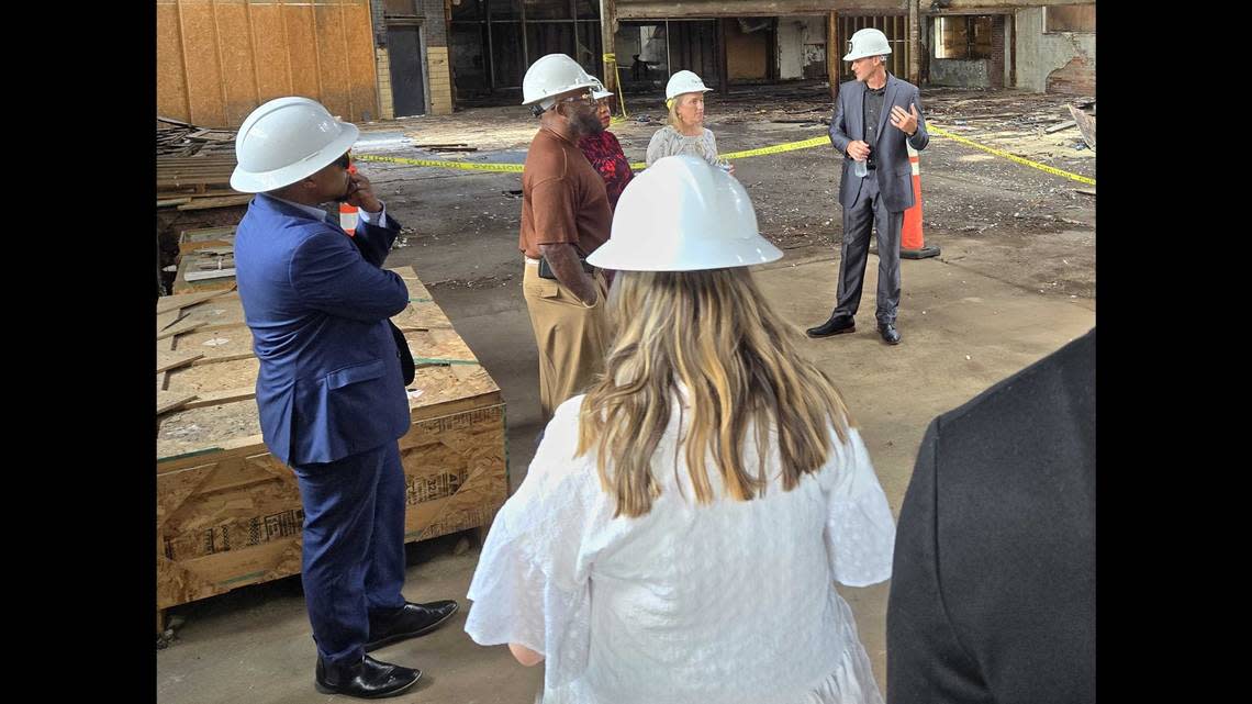 Dave Kuntz, R3 Development executive director, far right, shows Illinois U.S. Rep. Nikki Budzinski where the nonprofit will build its new workforce training center next door to the current building.