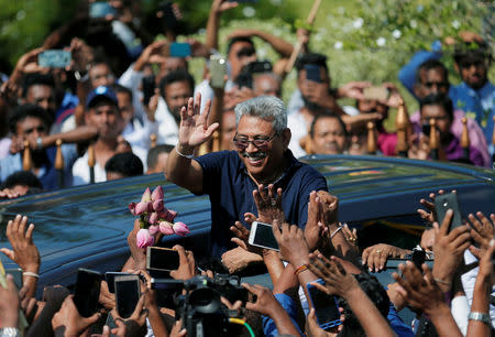 Sri Lanka's former defense secretary Gotabaya Rajapaksa greets his supporters after his return from the United States, in Katunayake, Sri Lanka April 12, 2019. REUTERS/Dinuka Liyanawatte