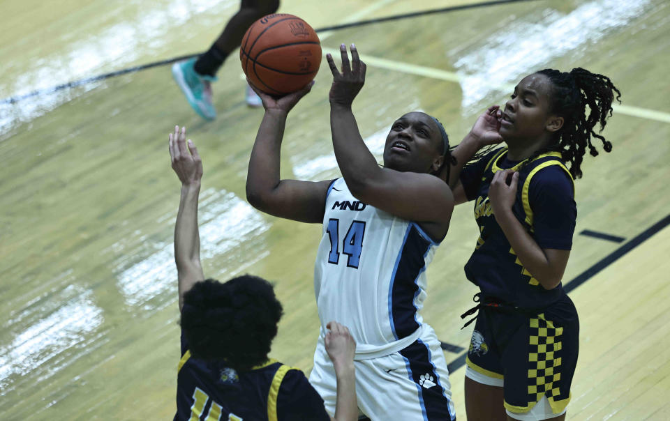 Mount Notre Dame guard Kailee Bransford, driving to the basket in Monday's win over Walnut Hills, is the Girls Greater Catholic League player of the year.