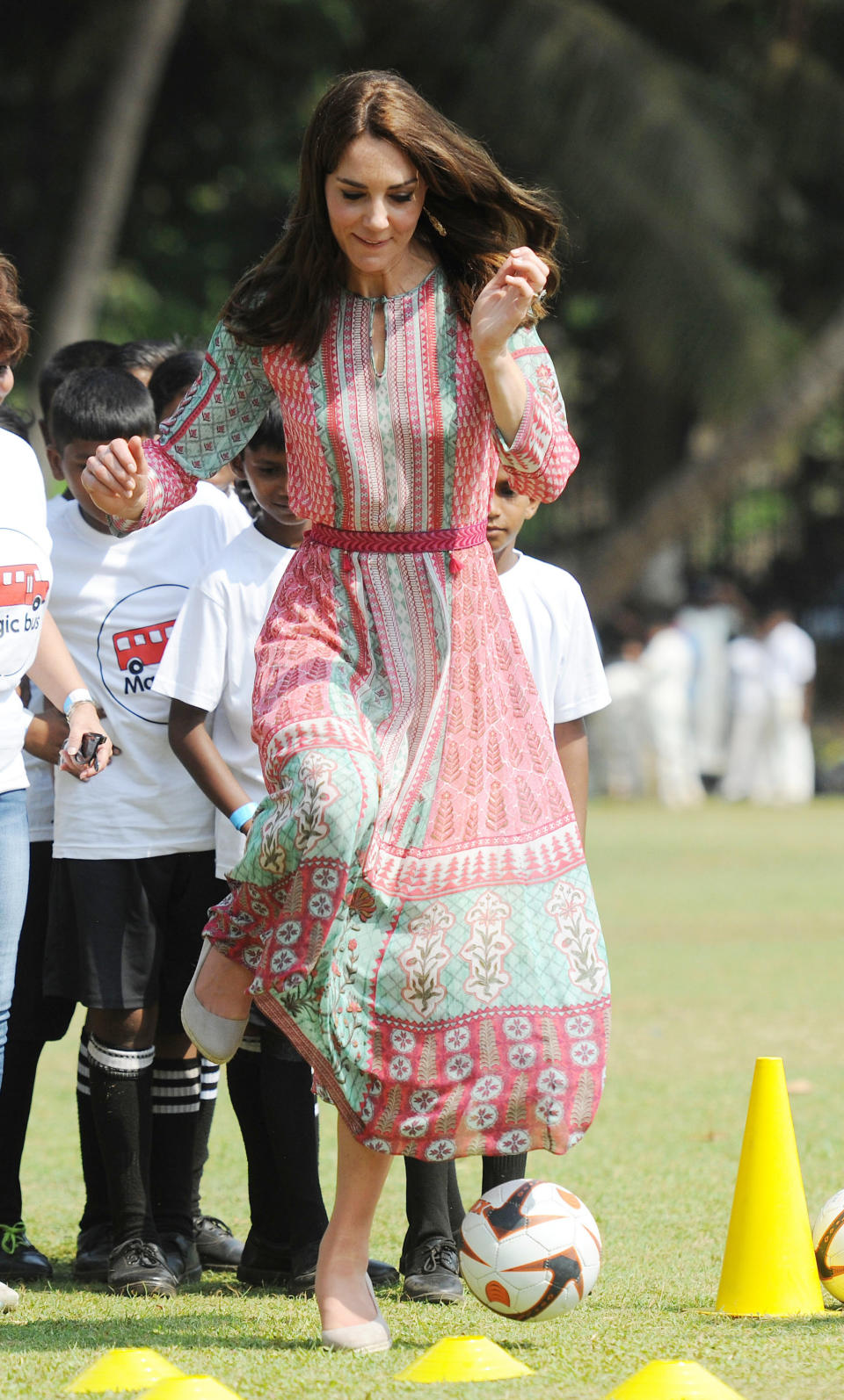 <p><span>While most prefer cleats when playing soccer, Middleton proved royals do it different: wearing wedges for a game of soccer with children from three different Mumbai charities. Proving her competitive spirit, the Duchess didn’t hold back from kicking and passing the soccer ball. <em>(Photo via Getty Images)</em></span> </p>