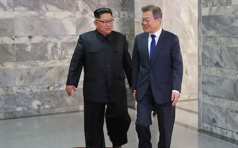 South Korea's President Moon Jae-in walks with North Korea's leader Kim Jong-un for their second summit  - Credit: AFP