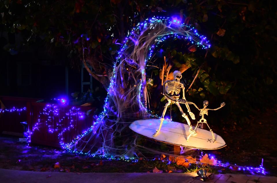 Some people get creative with their Halloween decorations, this house on A1A in Cocoa Beach has surfing skeletons riding a purple wave.

Syndication Florida Today