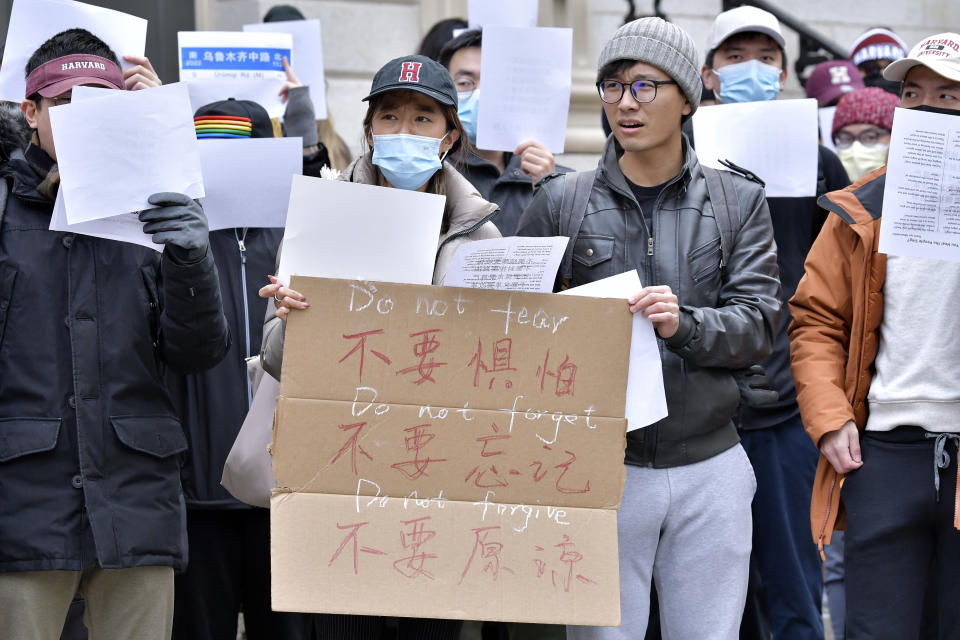 Dozens of students and faculty demonstrate against strict anti-virus measures in China, Tuesday, Nov. 29, 2022, at Harvard University in Cambridge, Mass. Protests in China, which were the largest and most wide spread in the nation in decades, included calls for Communist Party leader Xi Jinping to step down. (AP Photo/Josh Reynolds)