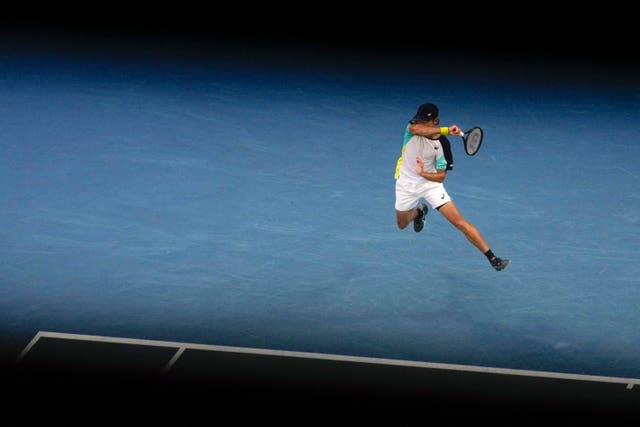 Australian Alex de Minaur leaps into a forehand during his win over Pablo Andujar 