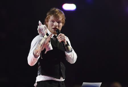 Ed Sheeran celebrates after receiving the British Album of the Year award at the BRIT music awards at the O2 Arena in Greenwich, London, February 25, 2015. REUTERS/Toby Melville