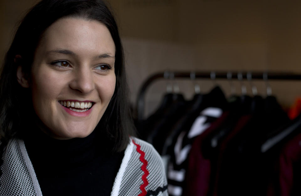 Fashion designer Sam Leutton originally from Stockport northern England, poses for a portrait at her booth in Somerset House, the main centre for London Fashion Week, where she is showing her designs in London, Monday, Feb. 17, 2014. A tale of two Britain's has emerged after the Great Recession on this economically hobbled island. While politicians trumpet the country’s recovery from the financial crisis and its status as the world’s fastest growing developed economy, the figures point to a growing divide, one that pits London’s growing boom against the malaise in once-affluent cities such as Manchester that are struggling to remain vibrant in the 21st century.(AP Photo/Alastair Grant)