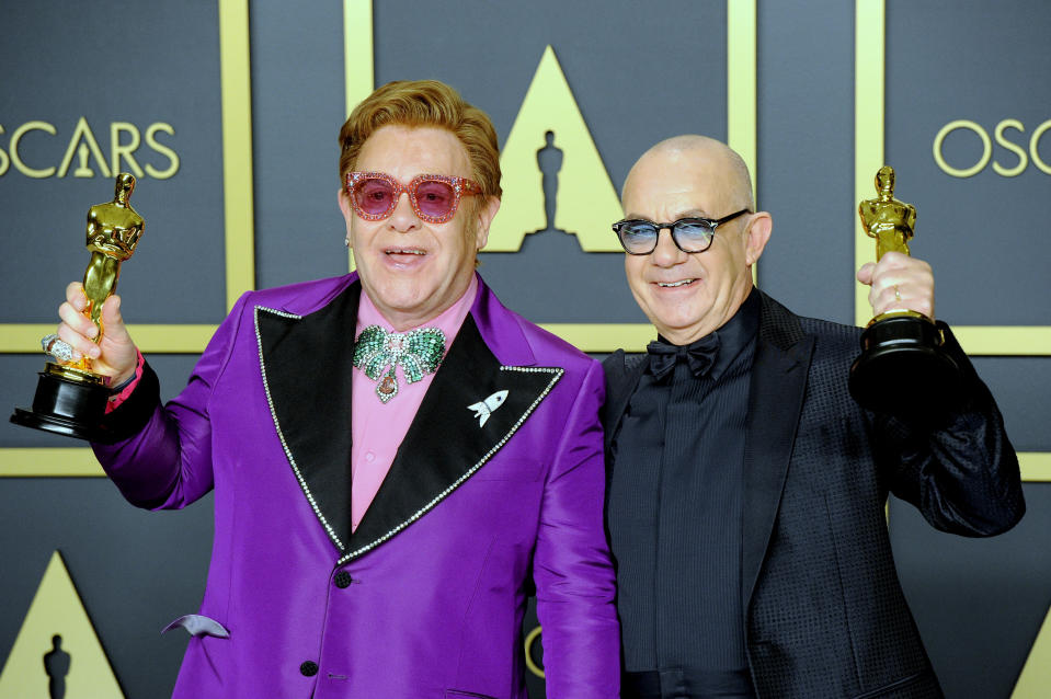 Sir Elton John and Bernie Taupin pose with their Awards for Best Original Song, "I'm Gonna Love Me Again" ('Rocketman') inside The Press Room of the 92nd Annual Academy Awards held at Hollywood and Highland on February 9, 2020 in Hollywood, California.  (Photo by Albert L. Ortega/Getty Images)