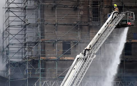 Fire fighters battle a blaze at the Glasgow School of Art for the second time in four years   - Credit: Getty