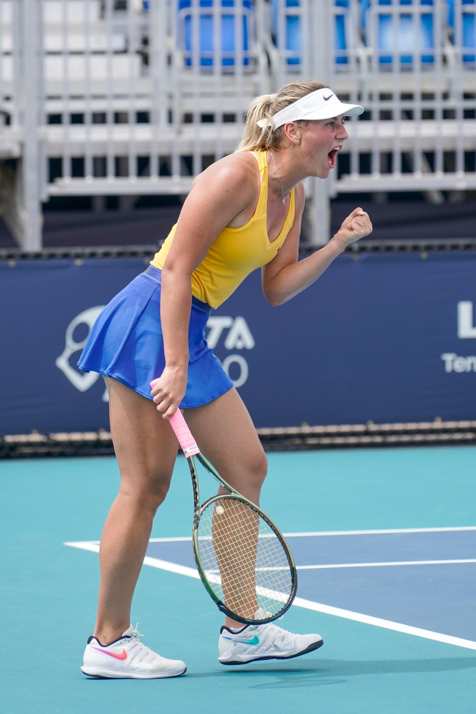 Marta Kostyuk (pictured) hits a shot during qualifying round of the Miami Open.